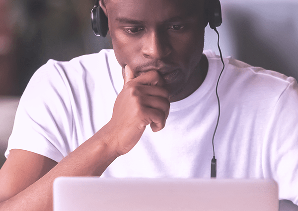 Man in headphones using laptop