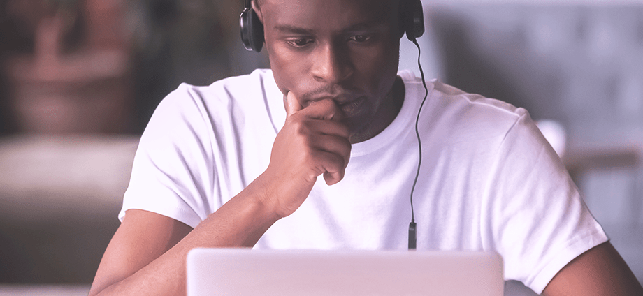Man in headphones using laptop